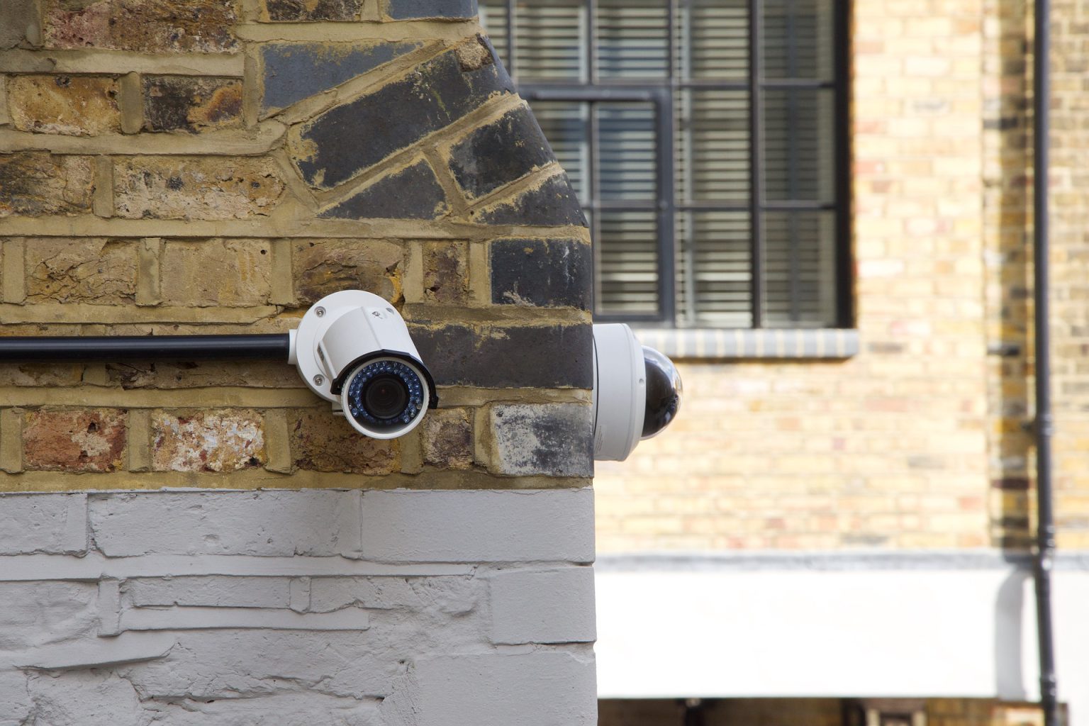Security cameras professionally mounted on the exterior of a building